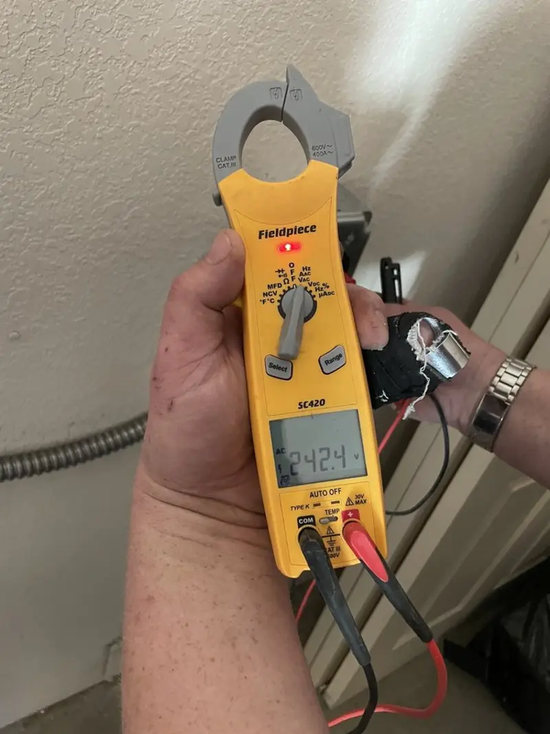 Voltage testing with clamp meter during Circuit Breaker Repair in Somers